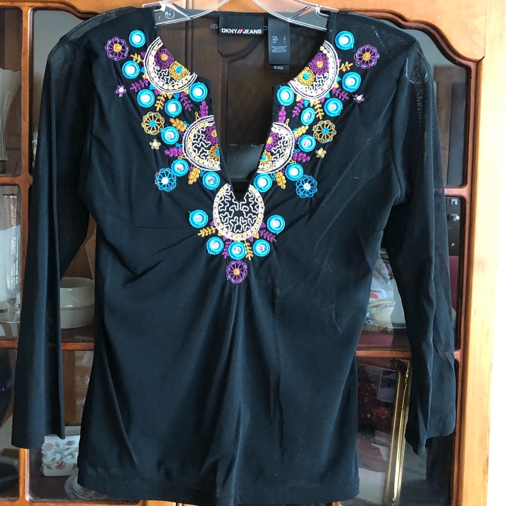 DKNY black mesh top with design.